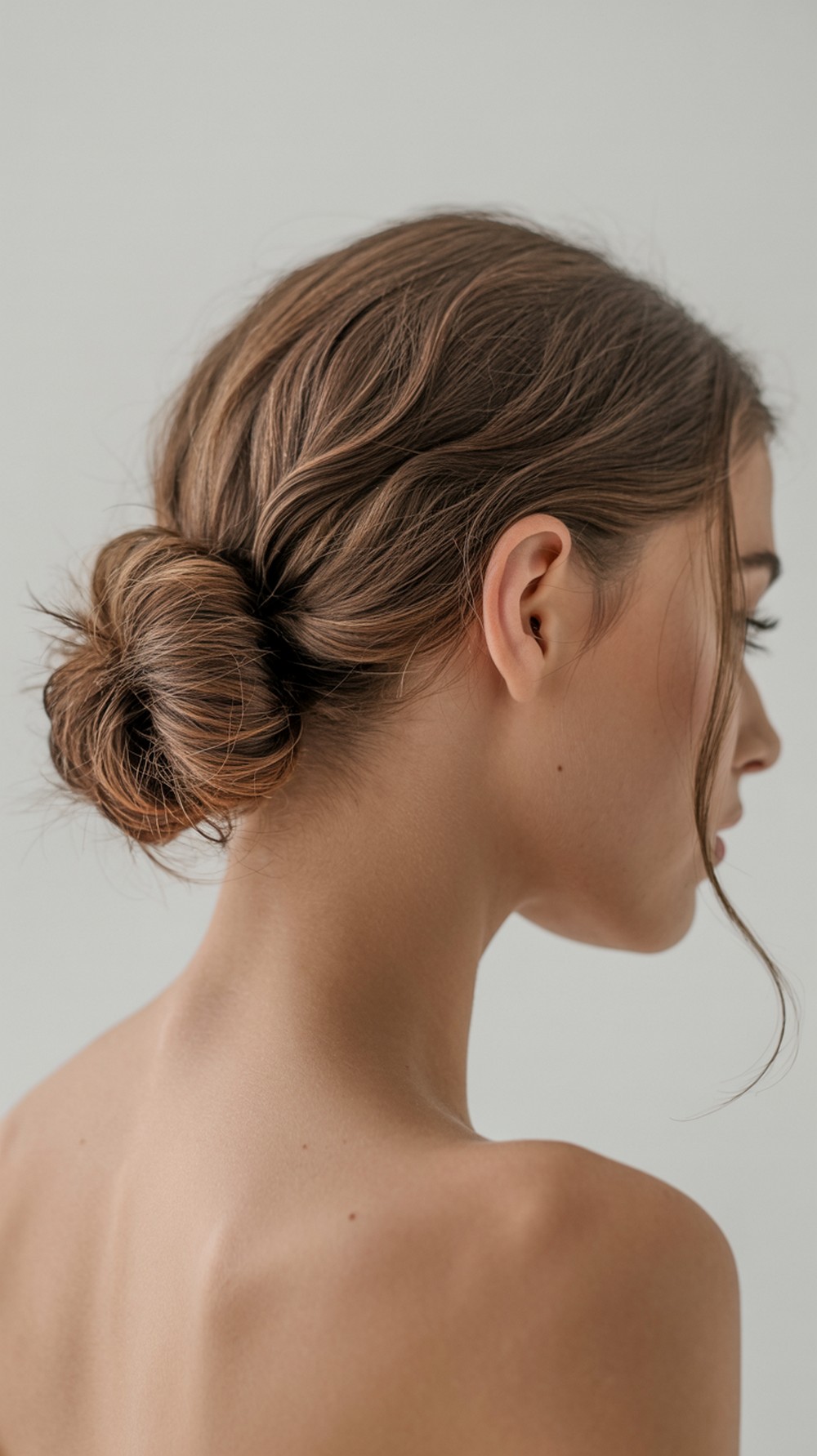 Low Bun with Tendrils Hairstyle